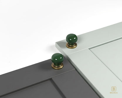 Belnua - ZERRA knob with plain dark green porcelain/ceramic on porcelain white and navy blue cabinet door