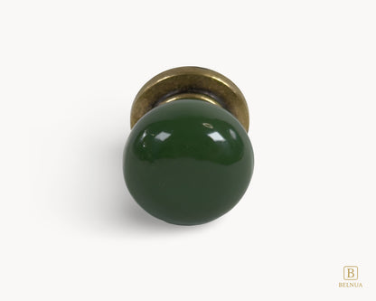 Belnua - Front flat lay of antique brass knob with dark green porcelain insert from Zerra collection