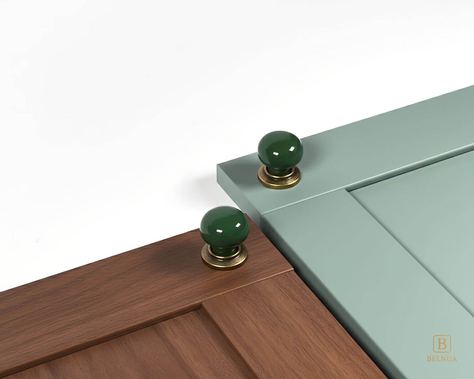 Belnua - ZERRA knob with plain dark green porcelain/ceramic on walnut and sage green cabinet door