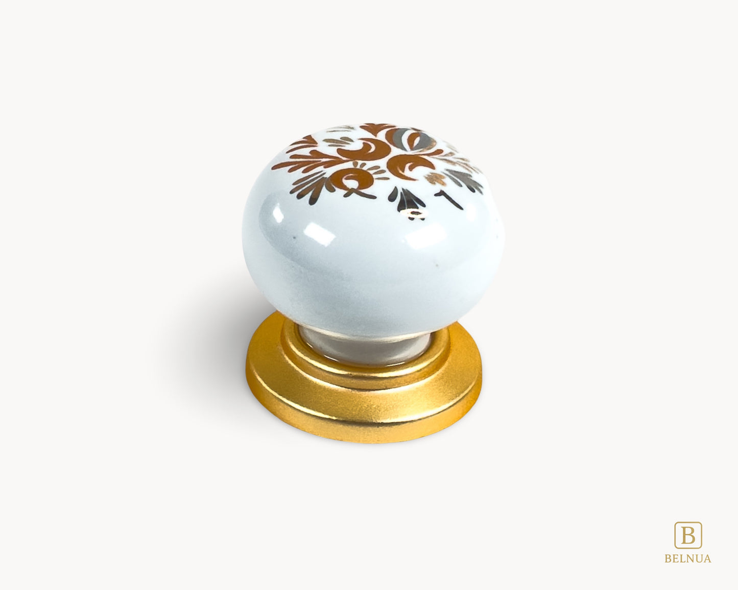 Belnua - Delicate ZERRA white cabinet porcelain/ceramic knob with matte gold finish and golden arch motif with close up top view