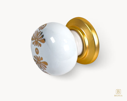 Belnua - Left angled view of ZERRA matte gold knob with white floral porcelain
