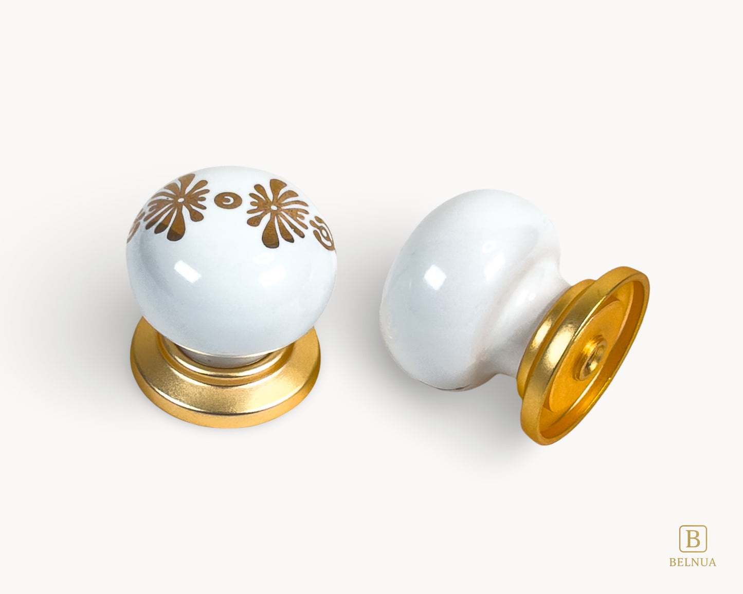 Belnua - Top and right back angled view of ZERRA matte gold knob with white floral porcelain