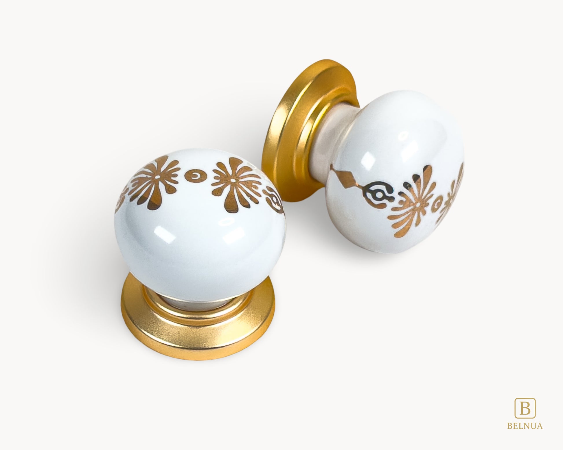 Belnua - Top and right angled view of ZERRA matte gold knob with white floral porcelain