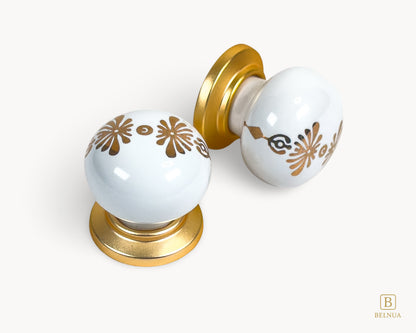 Belnua - Top and right angled view of ZERRA matte gold knob with white floral porcelain
