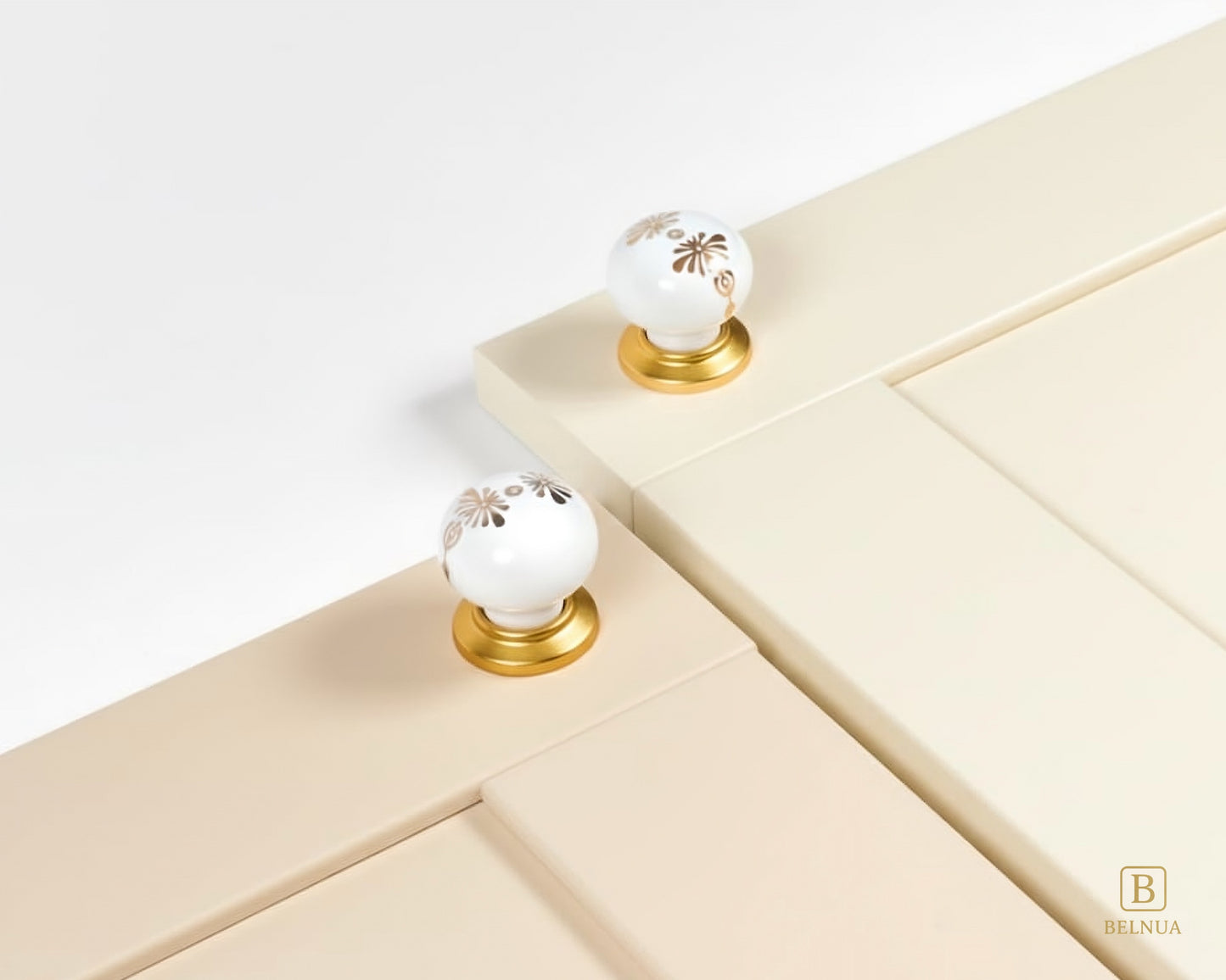 Belnua - ZERRA porcelain/ceramic knob with golden blossom motif on cream & cashmere cabinet door
