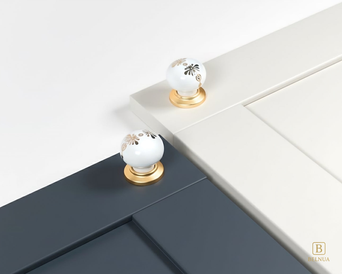 Belnua - ZERRA porcelain/ceramic knob with golden blossom motif on cream & navy blue cabinet door