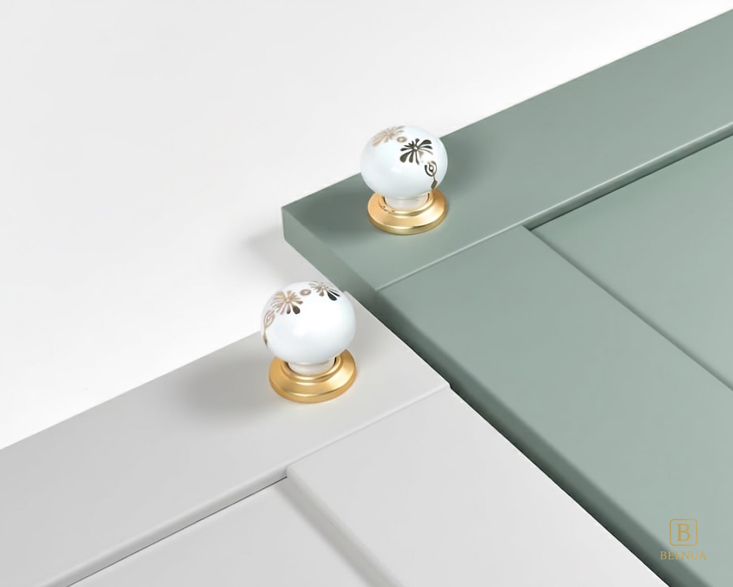 Belnua - ZERRA porcelain/ceramic knob with golden blossom motif on dove grey & sage green cabinet door