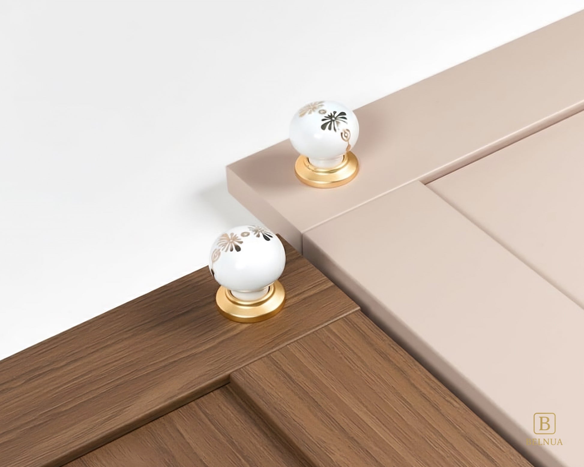 Belnua - Belnua - ZERRA porcelain/ceramic knob with golden blossom motif on mocha wood grain and soft pink cabinet door