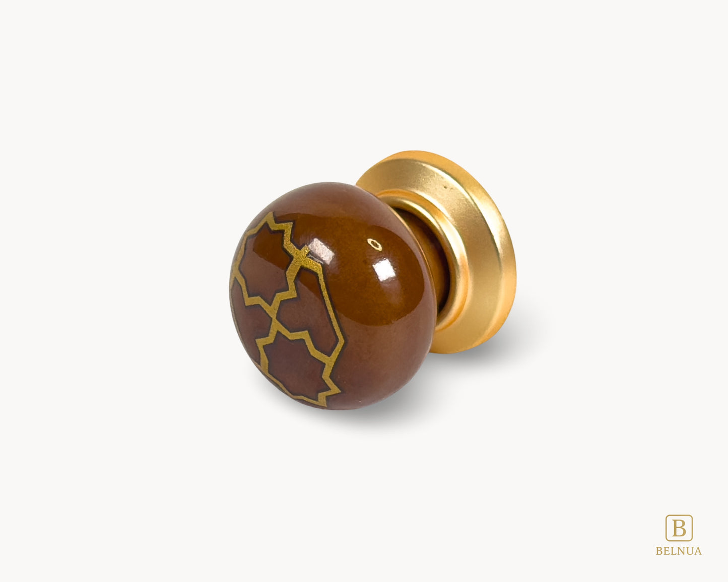Belnua - Left angled flat lay view of ZERRA golden tile knob on brown porcelain insert