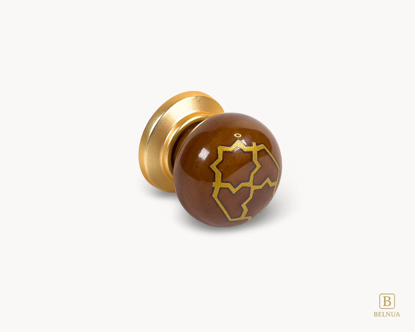 Belnua - Right angled flat lay view of ZERRA golden tile knob on brown porcelain insert white background