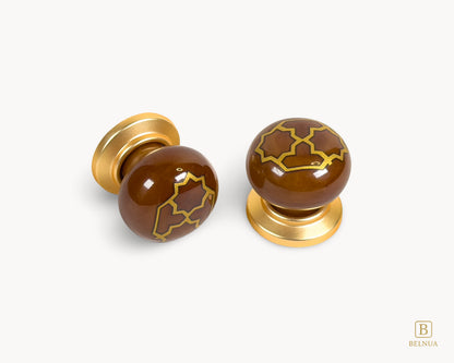 Belnua - ZERRA brown porcelain knob pairs with golden tile motif and matte gold finish