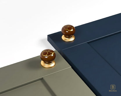 Belnua - ZERRA porcelain/ceramic brown knob with golden tile motif on olive grey & deep navy cabinet door
