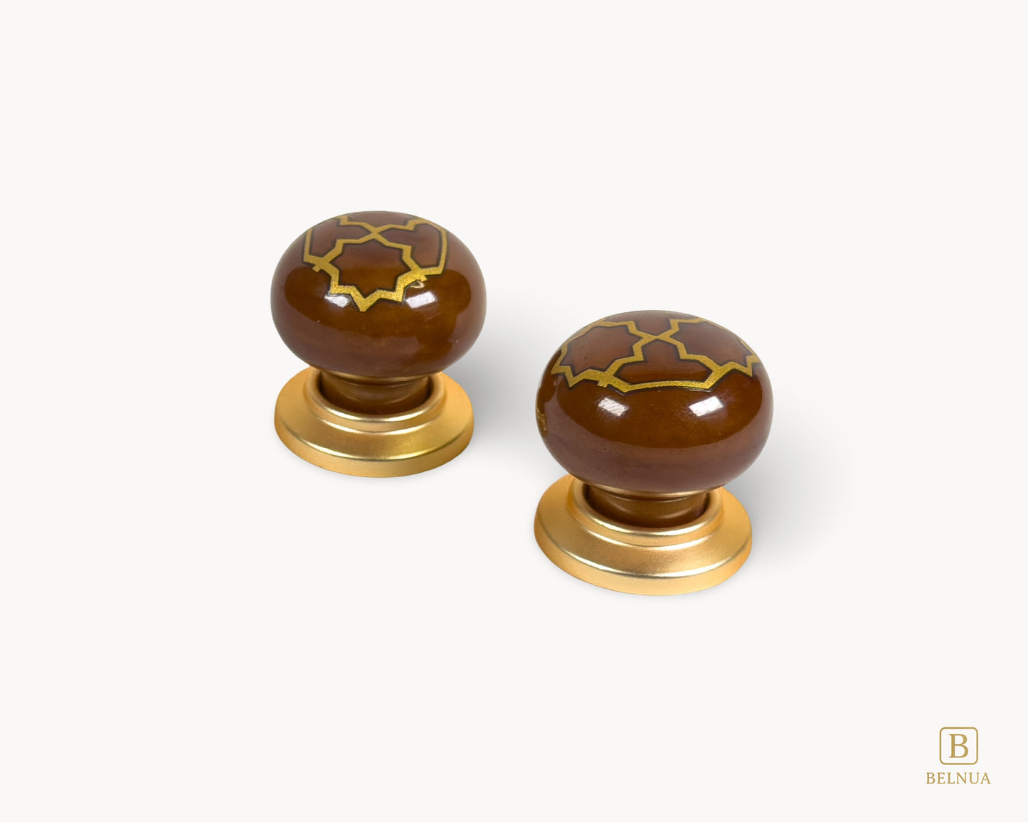 Belnua - Right angled flat lay view of ZERRA golden tile cabinet knobs on brown porcelain insert with white background