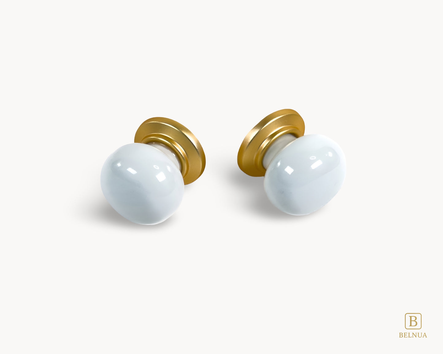 Front angled flat lay view of Zerra white porcelain knob with gold base | Belnua