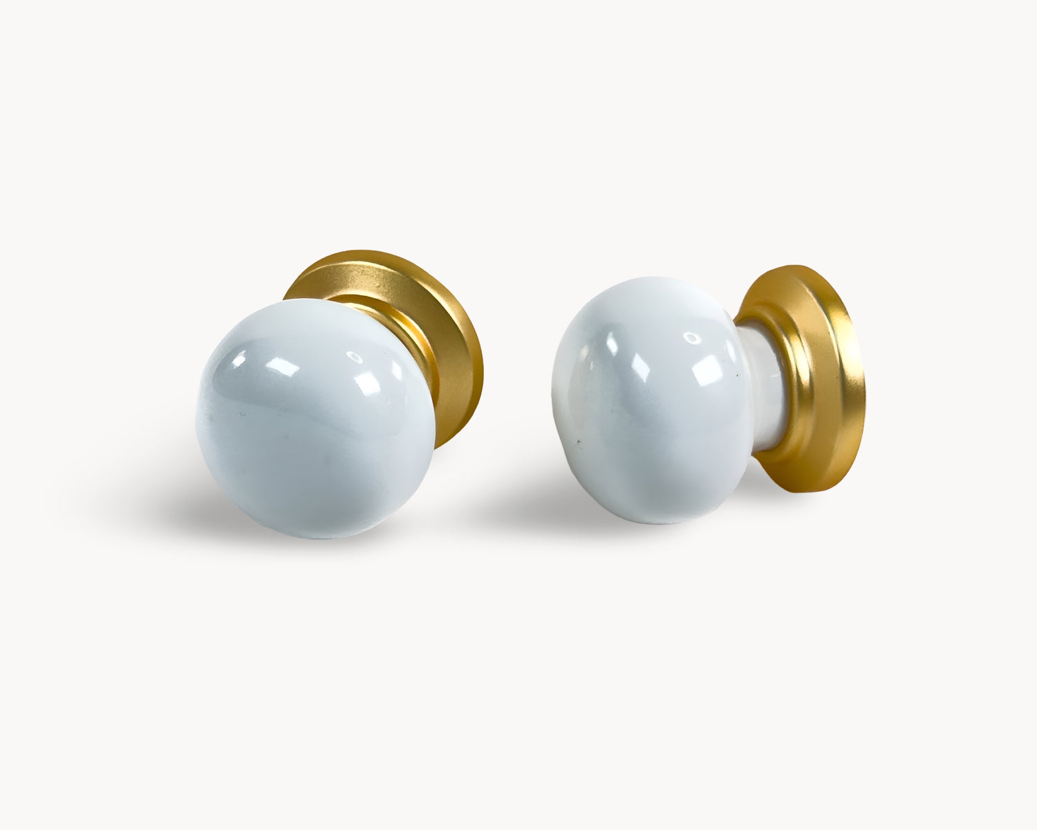 Pair of Zerra gold with white porcelain / ceramic insert in flat lay view | Belnua