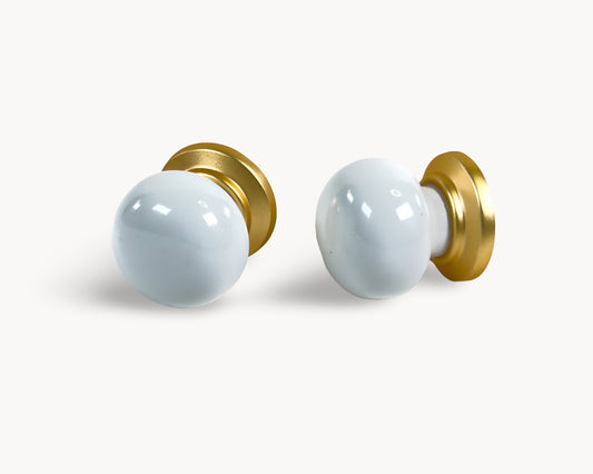 Pair of Zerra gold with white porcelain / ceramic insert in flat lay view | Belnua