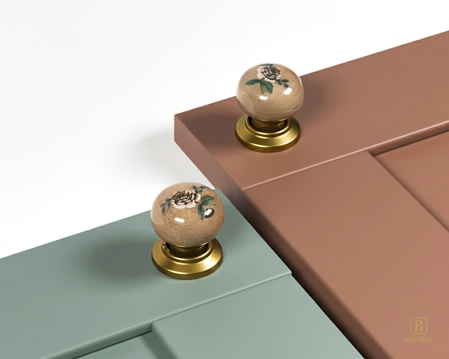 Belnua - ZERRA porcelain/ceramic tan knob pair with elegant rose motif on sage green & warm terracotta cabinet door showcase
