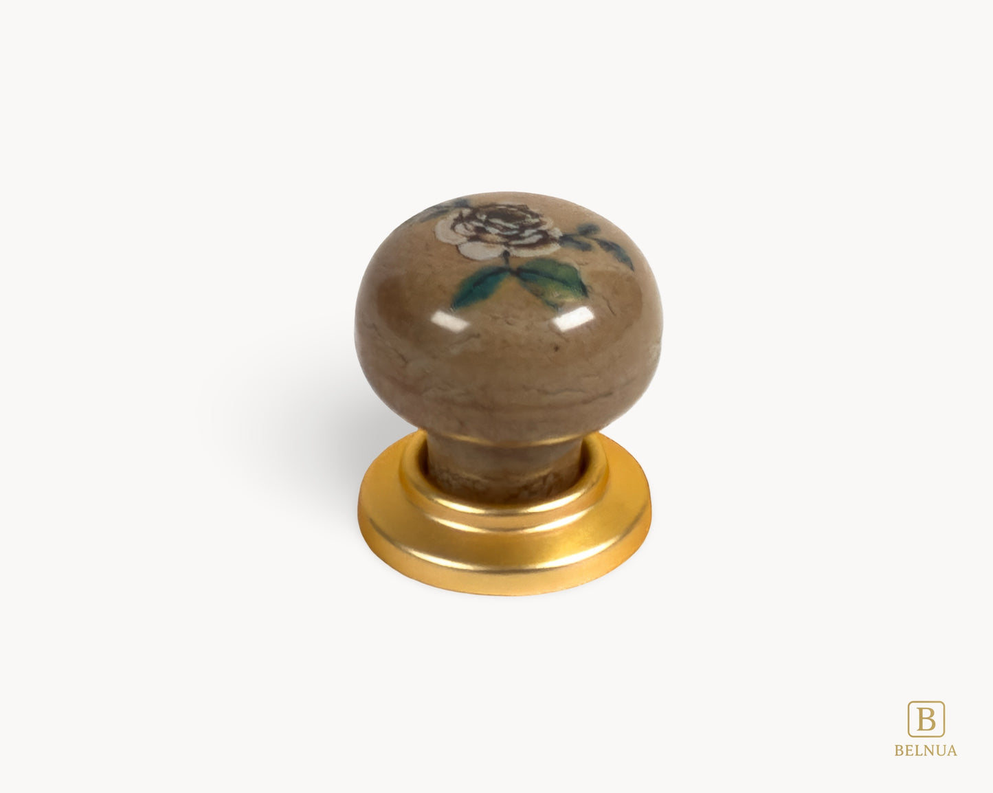 Belnua - Close up view of ZERRA ceramic/porcelain knob showing matte gold finish and rose motif