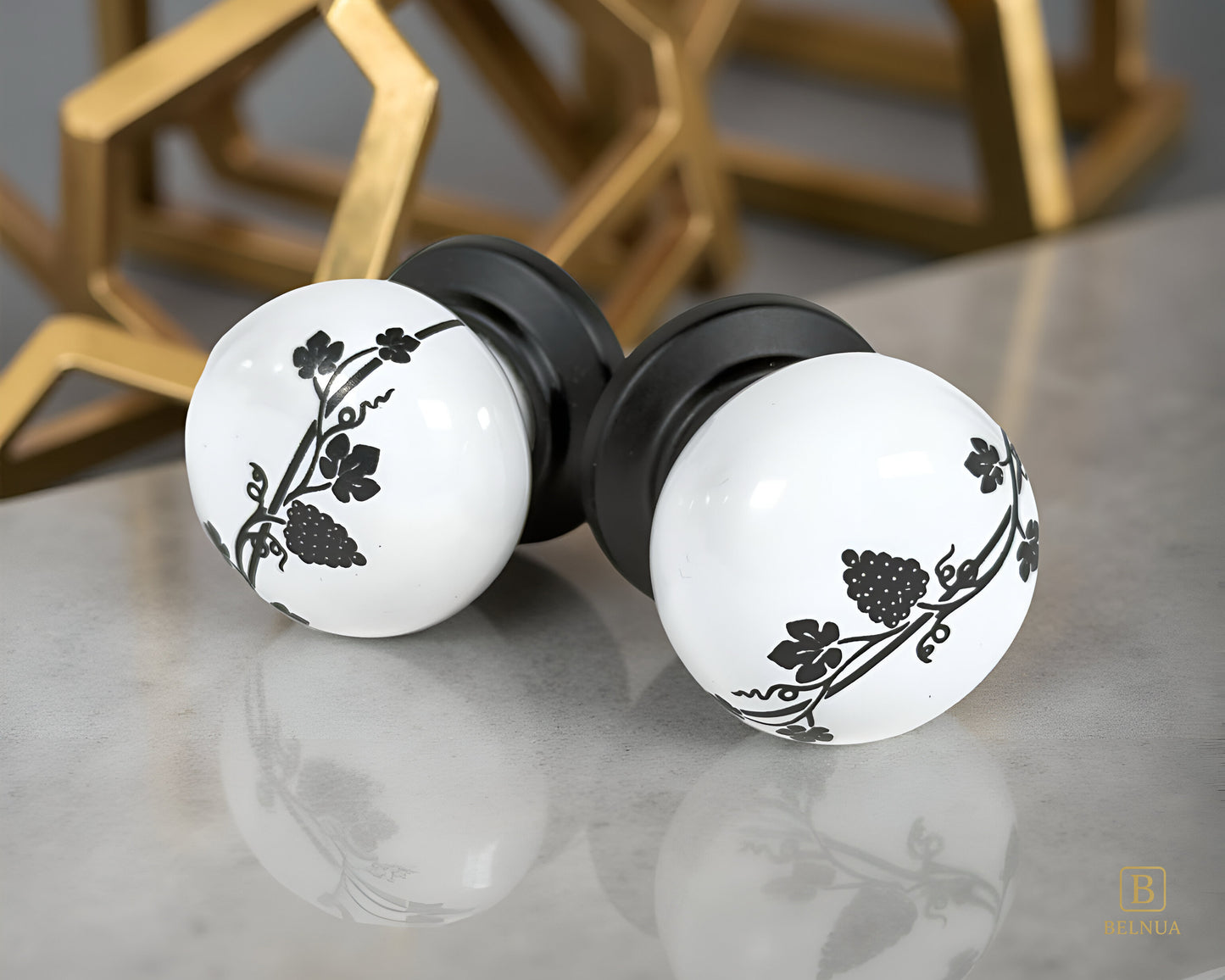 Belnua - Pair of ZERRA white porcelain knob with matte black base on quartz worktop surface
