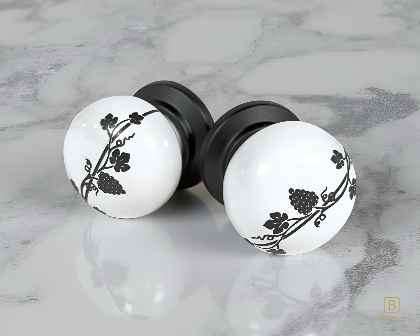 Belnua - Pair of ZERRA white porcelain knob with matte black base on marble surface
