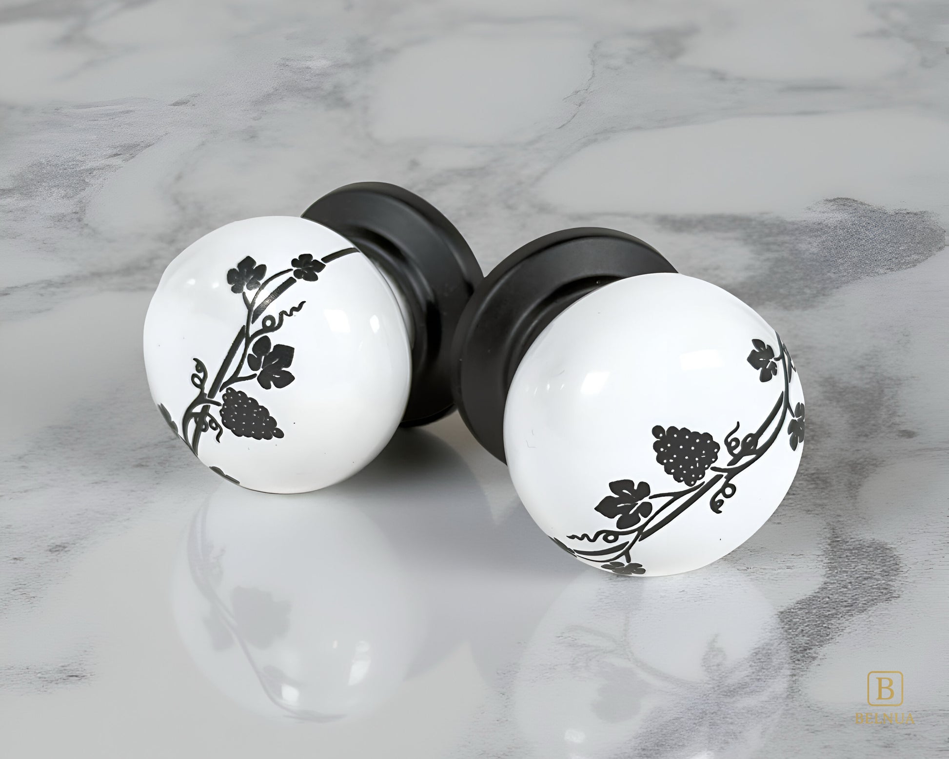 Belnua - Pair of ZERRA white porcelain knob with matte black base on marble surface