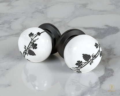 Belnua - Pair of ZERRA white porcelain knob with matte black base on marble surface
