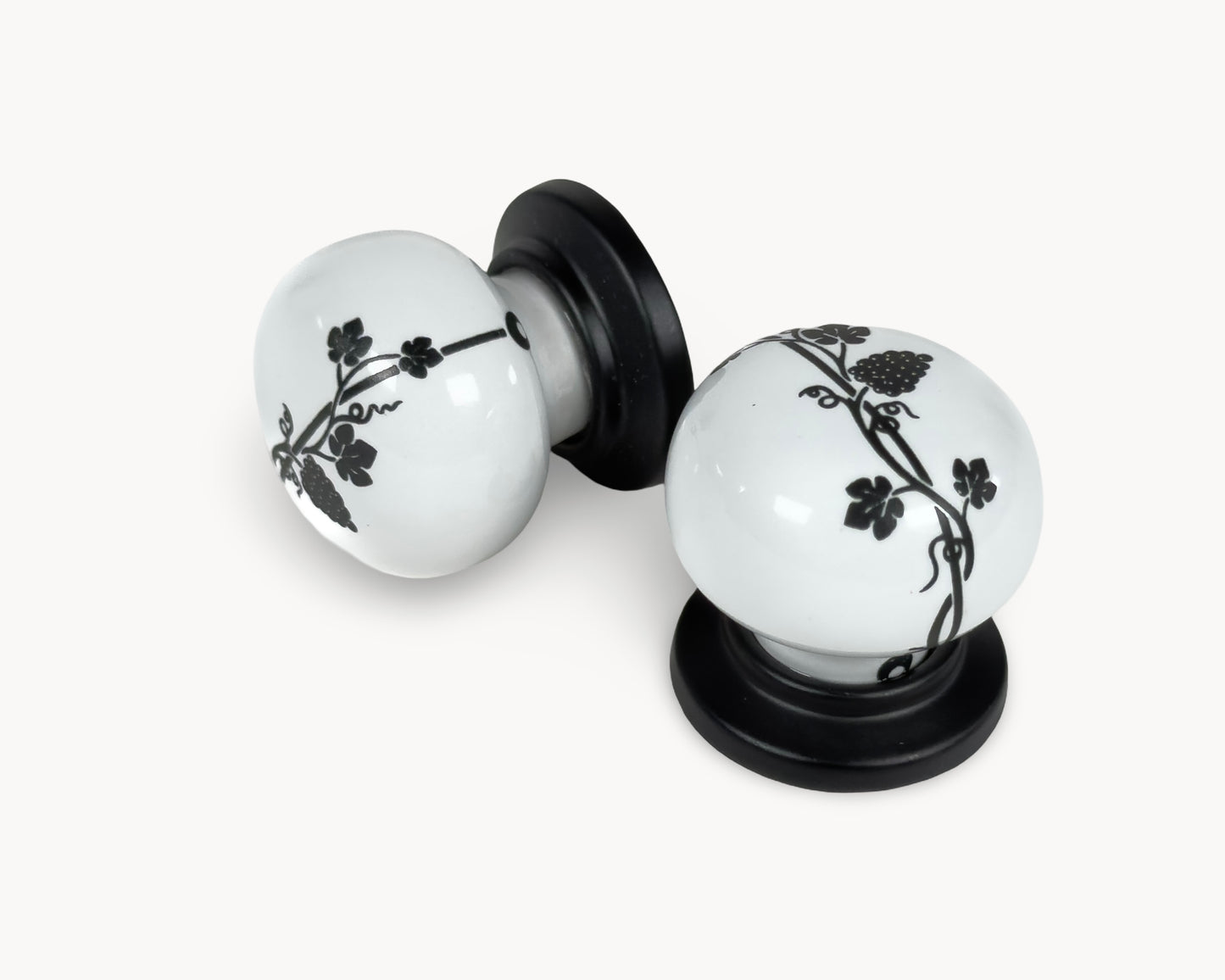 Belnua - ZERRA cabinet knob with black leaf motif on white porcelain and matte black base
