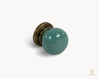 Angled view showing antique brass base and turquoise porcelain from Zerra collection | Belnua