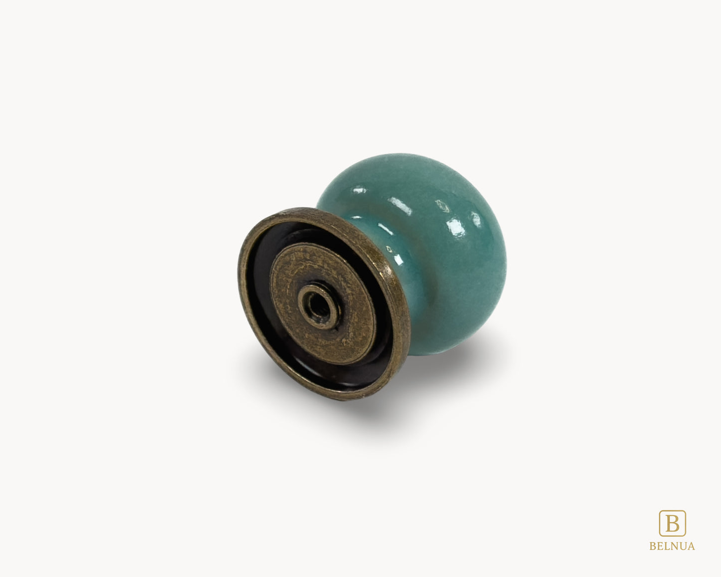 Back flat lay view of Zerra turquoise porcelain cabinet knob with brass hardware | Belnua
