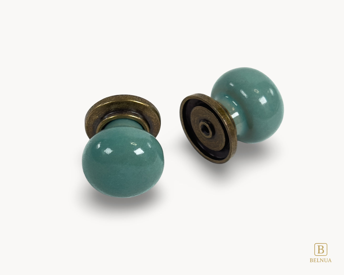 Front and back flat lay view of Zerra turquoise ceramic cabinet knobs with brass hardware | Belnua