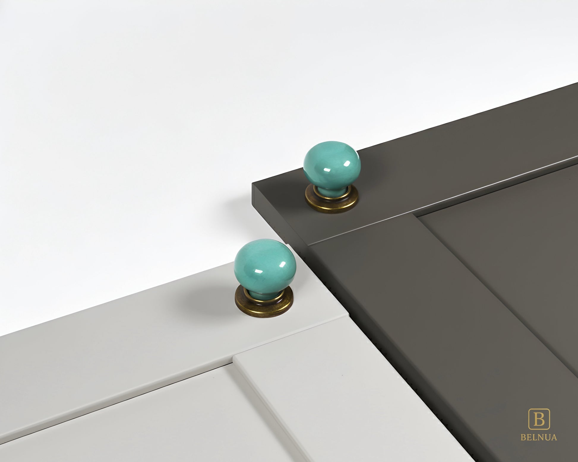Light grey and charcoal cabinet with turquoise knobs with brass base from Zerra collection | Belnua