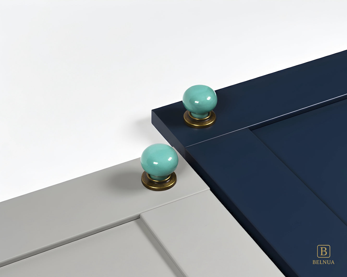 Light grey and navy blue cabinet with turquoise knobs with brass base from Zerra collection | Belnua