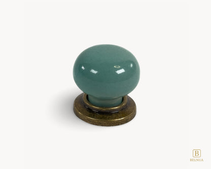 Top close-up of Zerra turquoise porcelain insert on antique brass knob | Belnua