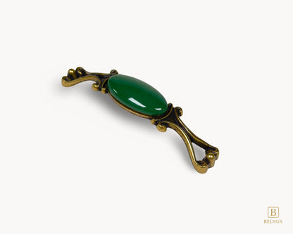 Belnua - Right angled view of Nureya decorative cabinet handle with dark green porcelain and brass base  on a white surface