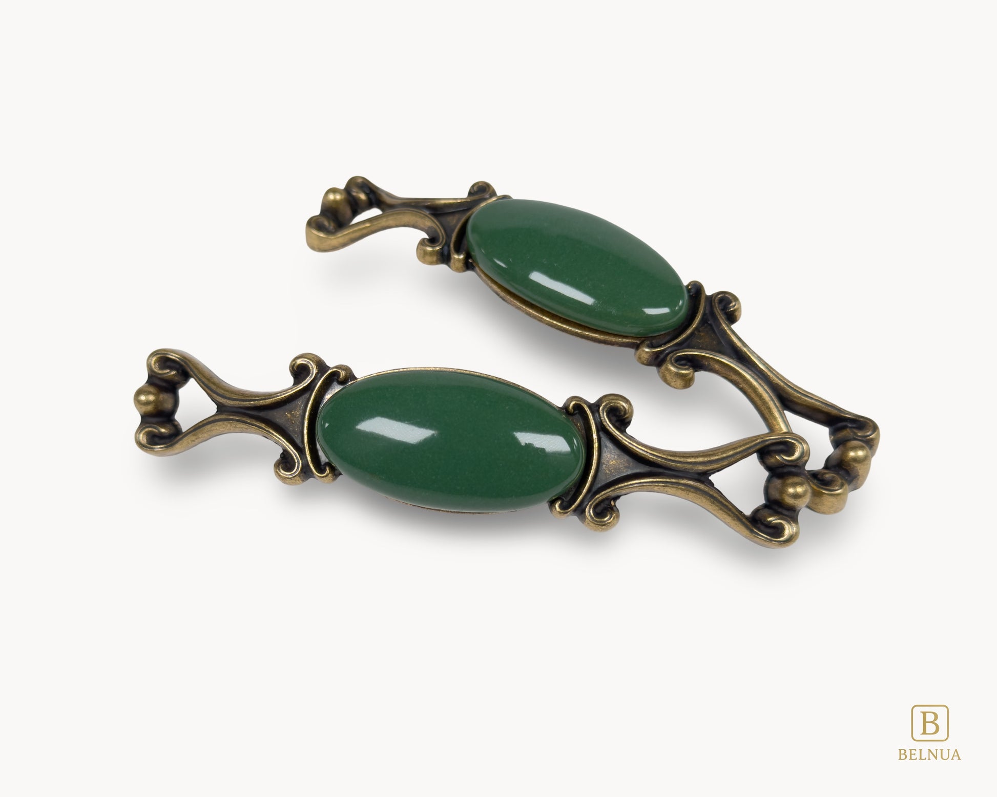 Belnua - Top and front view of Nureya decorative cabinet handle pair with dark green porcelain and brass base  on a white surface