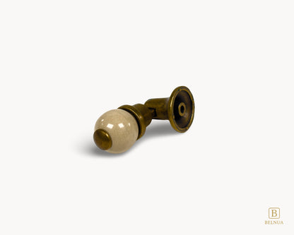 Belnua - Angled photo of orange and antique brass combination on VIRELLA knob