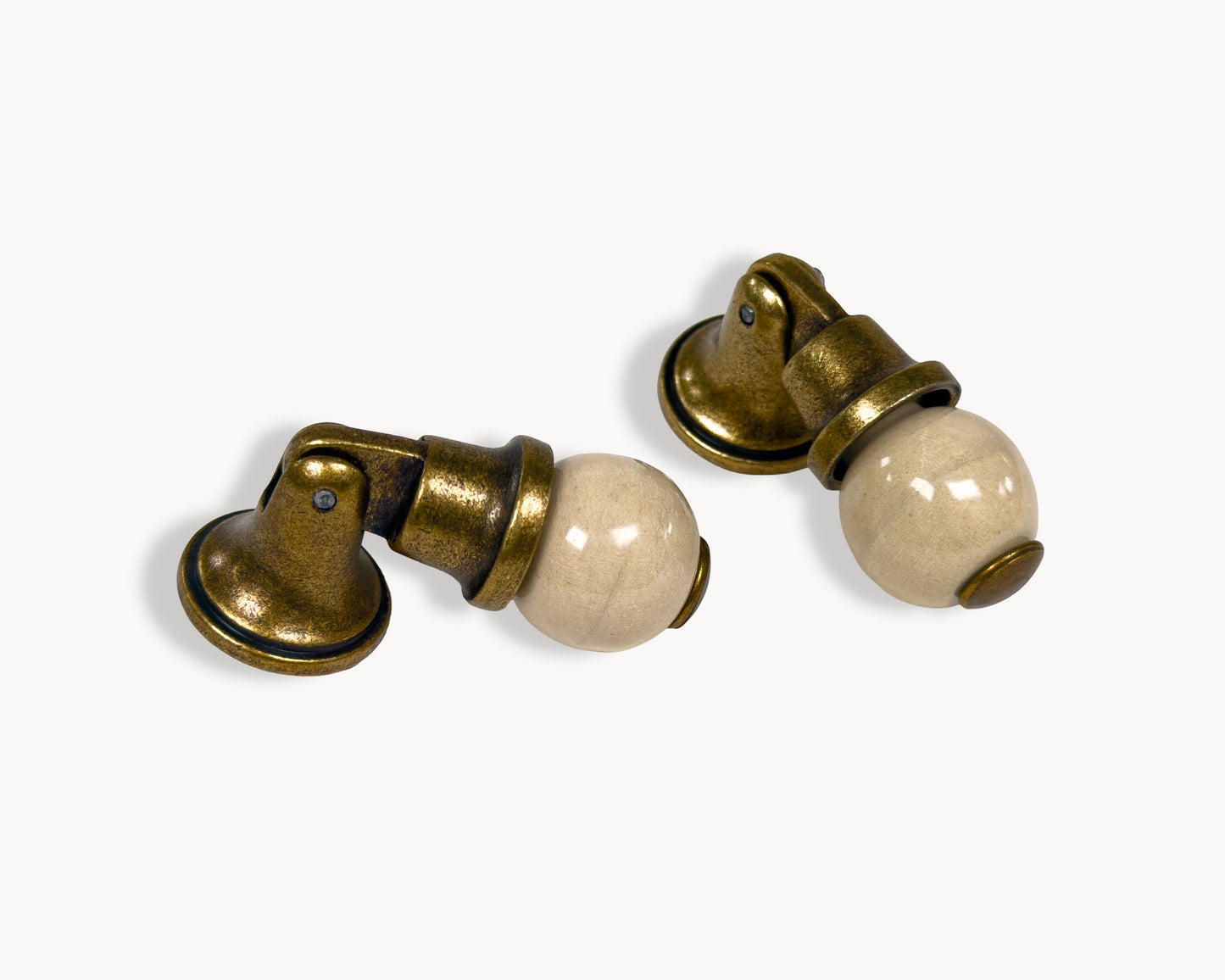 Belnua - VIRELLA knob in antique brass finish with smooth orange porcelain
