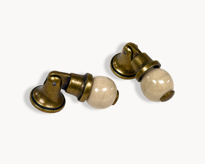 Belnua - VIRELLA knob in antique brass finish with smooth orange porcelain