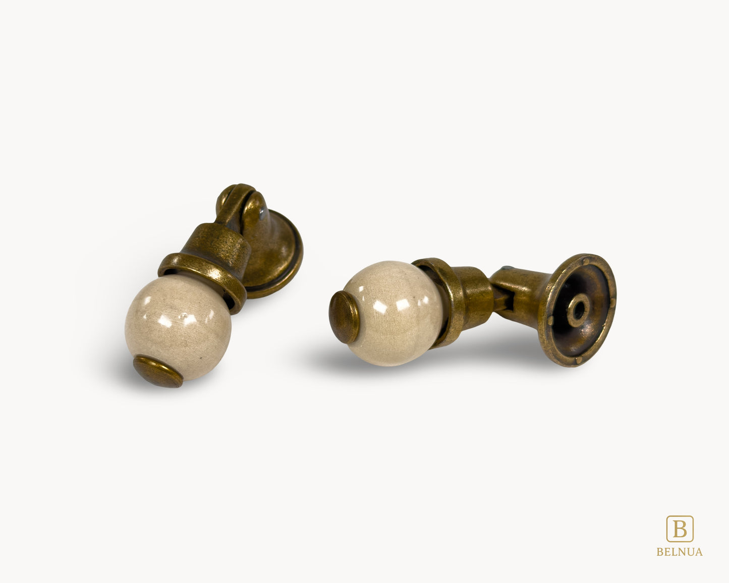 Belnua - Angled photo of orange and antique brass combination on VIRELLA knob pairs