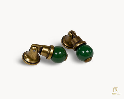 Belnua - Angled top view of green VIRELLA porcelain/ceramic cabinet knob pairs with sculptural form of brass base