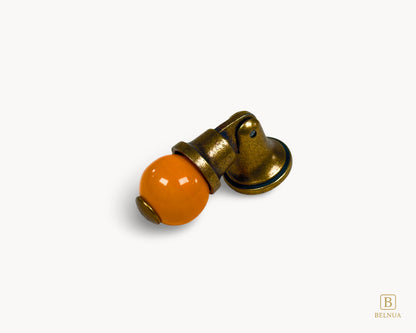Belnua - Left angled photo of orange and antique brass combination on VIRELLA knob