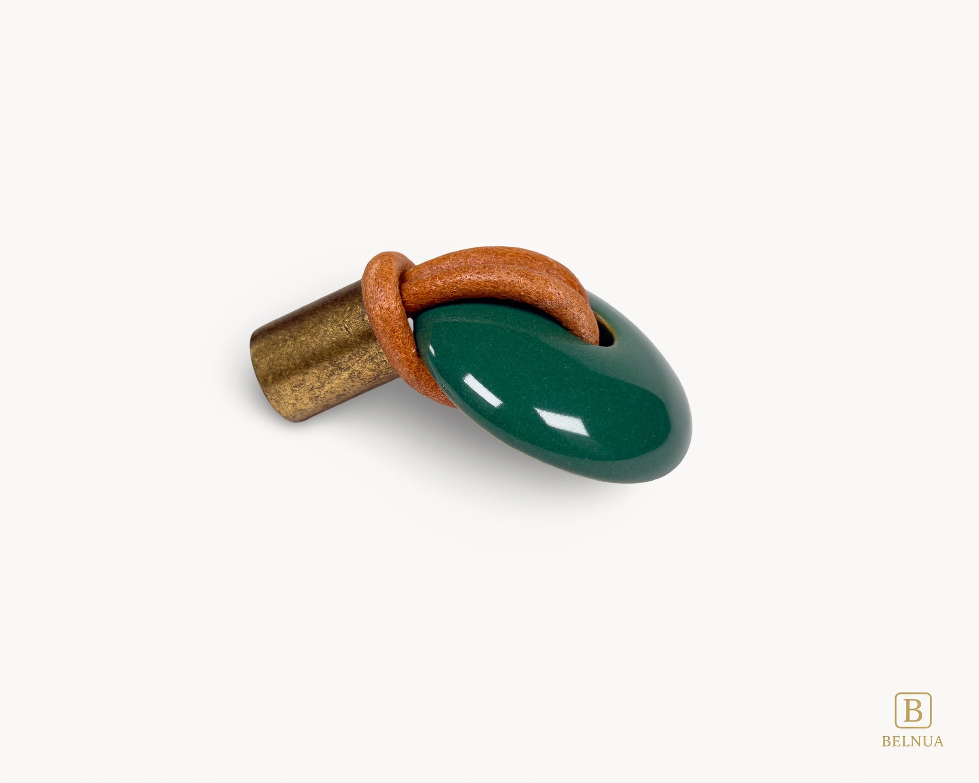 Side profile of green porcelain REVINA knob highlighting curved ceramic form