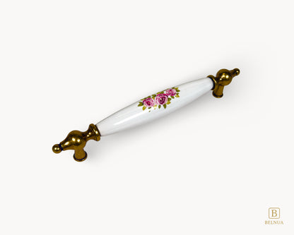 Angled view of Lumora 160mm antique brass floral porcelain handle