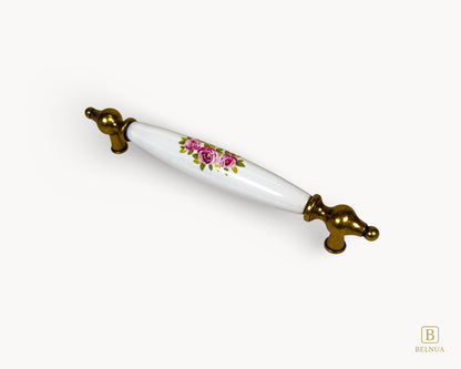 Perspective view of 160mm Lumora antique brass porcelain cabinet handle