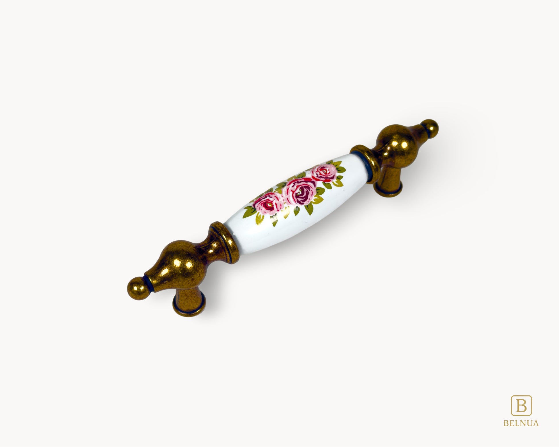Angled view of Lumora 96mm antique brass floral porcelain handle