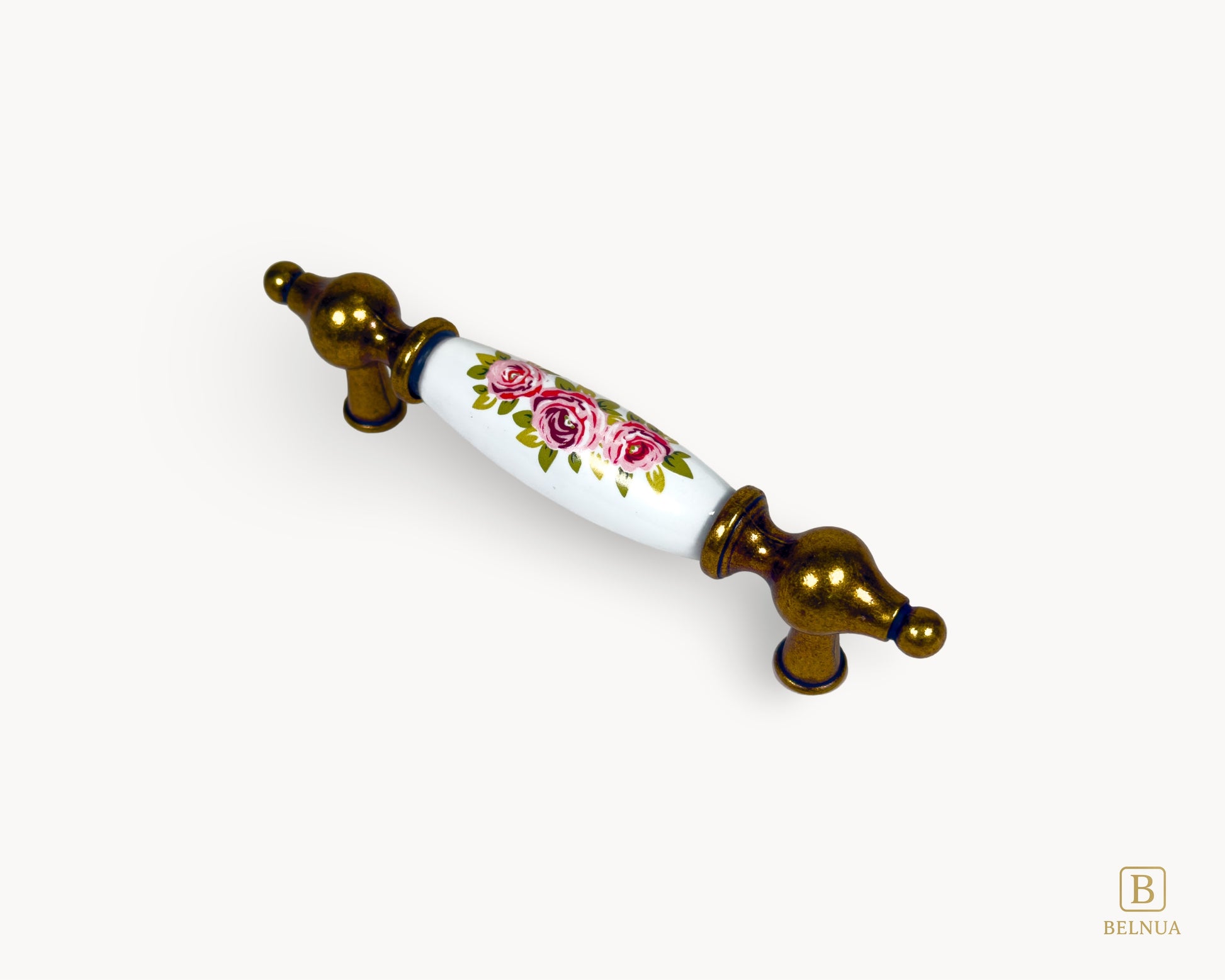 Perspective view of 96mm Lumora antique brass porcelain cabinet handle