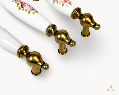 Top view of Lumora antique brass floral porcelain cabinet handles