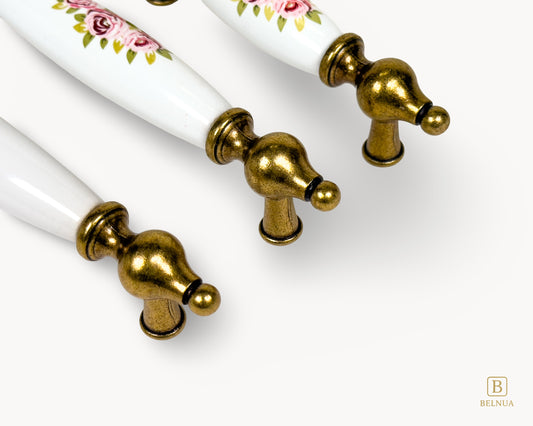 Top view of Lumora antique brass floral porcelain cabinet handles