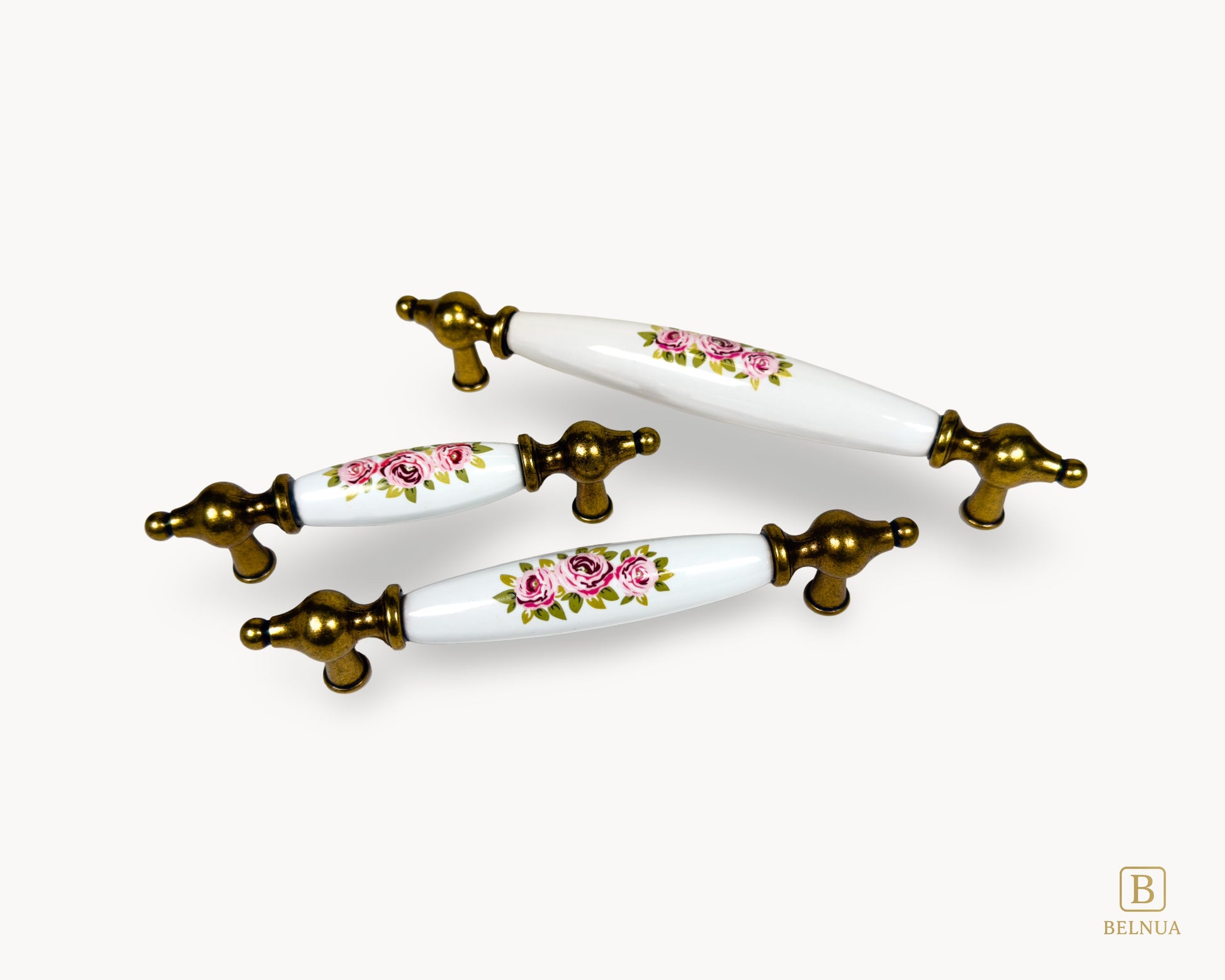 Close-up of antique brass ends and floral porcelain detail on Lumora handle