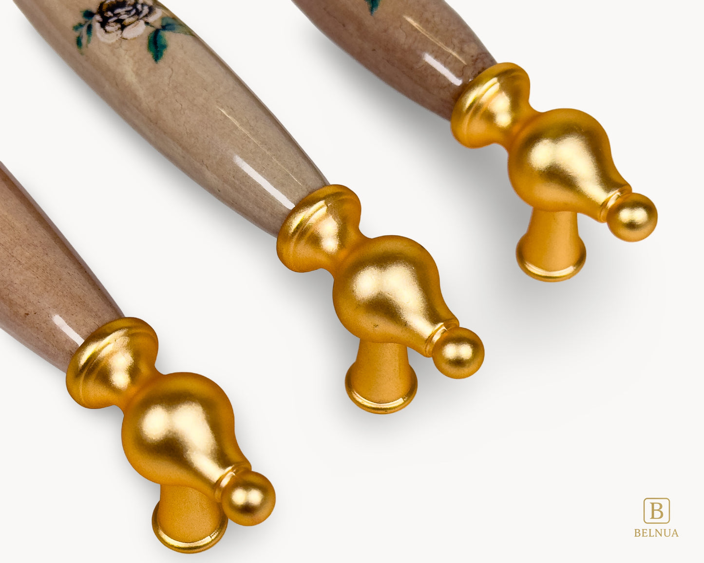 Close-up of Lumora gold handle showing brushed gold finish and porcelain texture